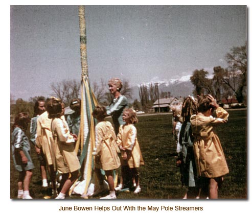 June Bowen helps out with the May Pole streamers.